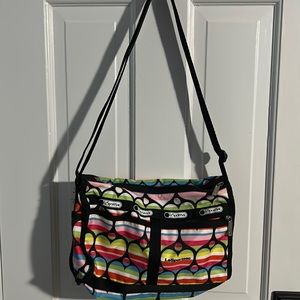 Multi colored Le Sportsac purse.